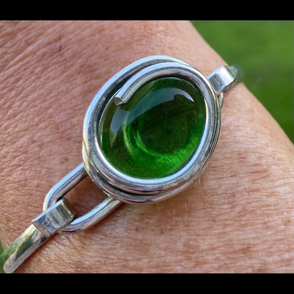 Silver bracelet with green stone